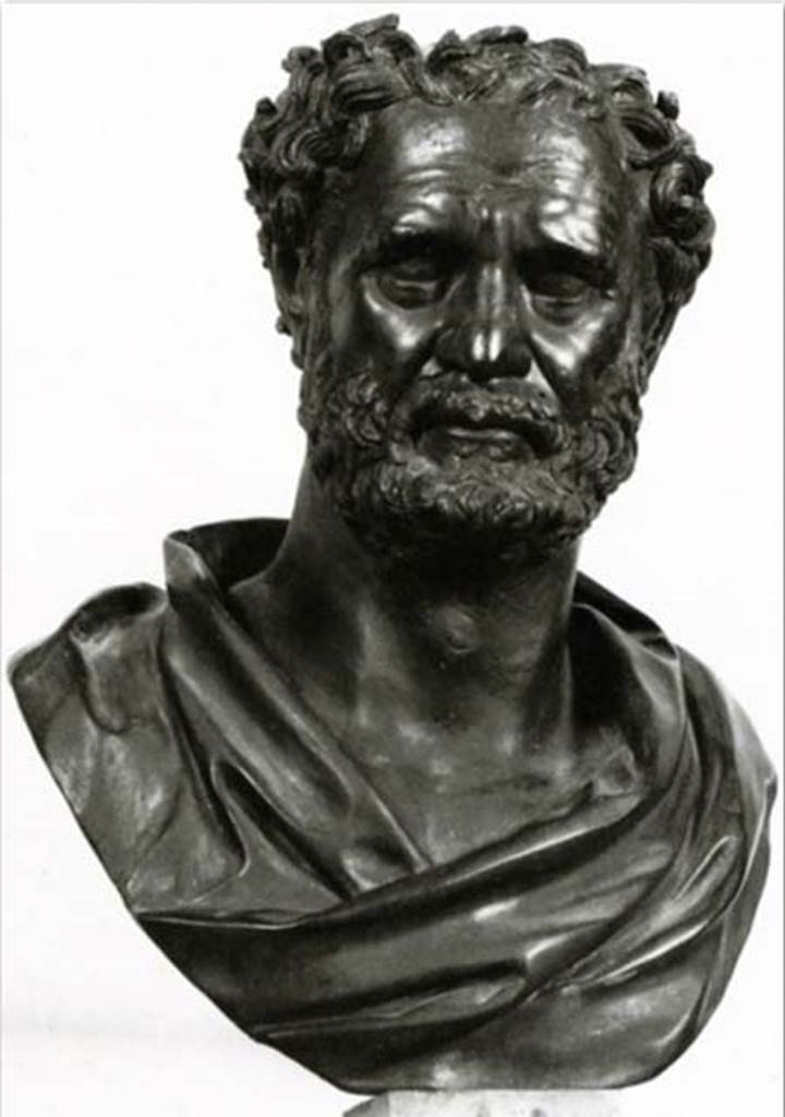 Villa dei Papiri, Herculaneum. Bust of Empedocles of Agrigento or Heraclitus. Found in 1753 in the angles of the peristyle.
Now in Naples Archaeological Museum. Inventory number 5623.
Concerning this sculpture, the Naples Museum web site says: The identification of the character remains problematic. In the past it was proposed to recognize in the piece as Eraclito, but, in more recent times, the hypothesis has been put forward that it is Empedocles of Agrigento (492-432 BC). This proposal finds comfort both in the words of Diogene Laerzio about the thick hair of the character and in the specific location of the bronze inside the villa where he made a counterpart with the bronze depicting Pythagoras (inv. 5607), who was his teacher. In fact, the two busts occupied two opposite corners of the square peristyle, an environment, of a certain importance considering that it is in the centre of the complex. This peristyle had a central basin and, at the corners, four fountains with a circular basin, behind each of which a bronze bust stood on a marble pillar; other sculptures adorned the southern portico and the extremities of the basin, which presents a series of semicircular niches.